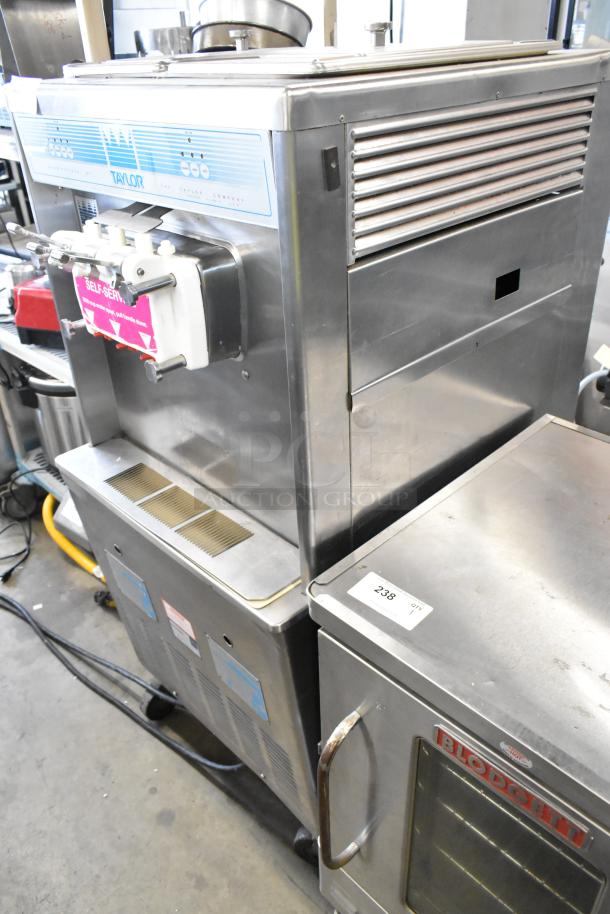 Taylor 339-27 soft serve ice cream machine, stainless steel, dual flavor with twist, air cooled, on casters, 208-230V.