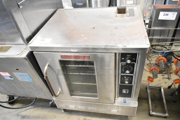Blodgett stainless steel commercial gas convection oven, half size, with view-through door, metal racks, thermostatic controls.