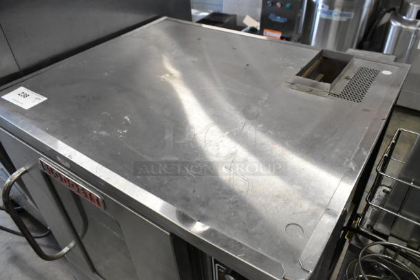 Blodgett stainless steel commercial gas convection oven with view-through door, metal racks, and thermostatic controls. Visible surface wear.