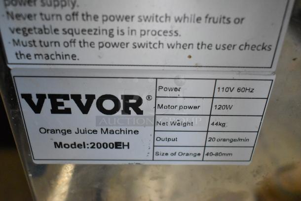 Vevor 2000EH commercial citrus juicer label. Shows 110V, 60Hz, 120W, 44kg weight, 20 oranges/minute, 40-80mm size.