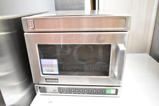 2025 Amana HDC10Y15 stainless steel commercial microwave, compact with push-button controls, 120V, USA label visible.