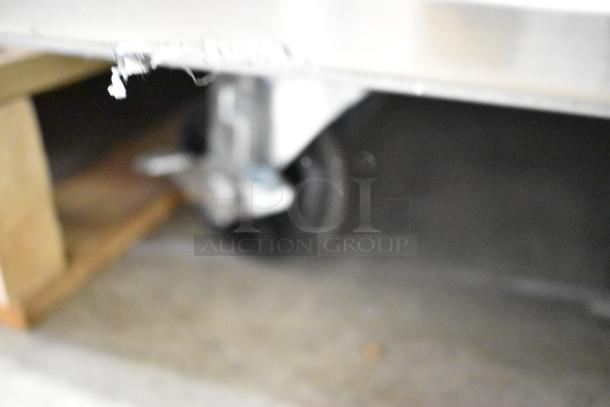 BRAND NEW 2023 Avantco 178SS2FHC 54" stainless steel reach-in freezer with commercial casters, minor scratch and dent.