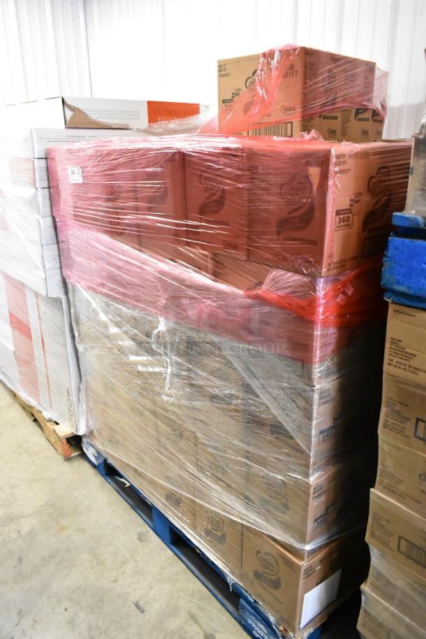 103 sealed boxes of Coffee Mate Creamers, each with 360 units, stacked on a pallet, wrapped in plastic. Brand new condition.