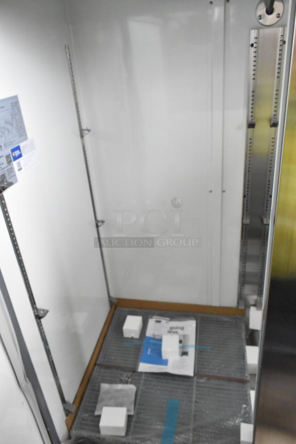 BRAND NEW 2025 Avantco 178A49FHC 54" stainless steel reach-in freezer, solid door, 115V, 1-phase, slight dents visible.