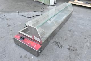 Brand new Avantco Bain Marie, stainless steel with glass top, visible control panel, minor scratches and dents.