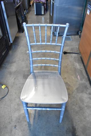 Silver Lancaster Chiavari chair, new with minor scratches, durable resin, elegant design, ideal for events.