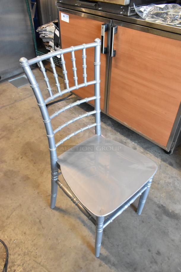 Silver resin Chiavari chair, brand new condition, by Lancaster Table & Seating, scratches and dents present.