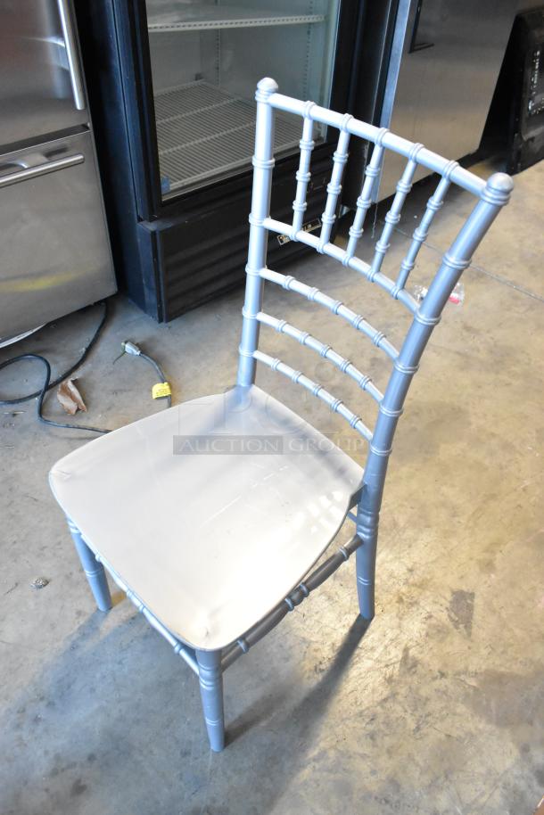Silver Lancaster Table & Seating 164CHIARSSLV Chiavari chair, new condition, slight scratches, resin material, elegant design.