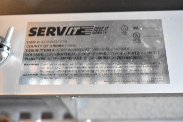 ServIt 423SW42TCPA metal commercial heating strip, 120V, 1 phase, 1050W. Includes label with specifications and warnings.