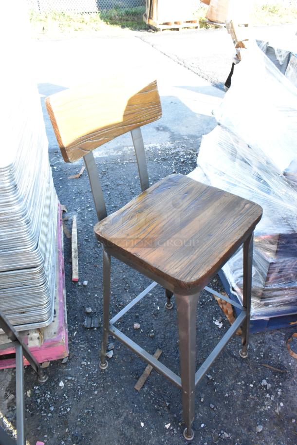 Metal bar height chair with wooden backrest and seat, durable metal frame. Used condition. Buyer receives 30 chairs.