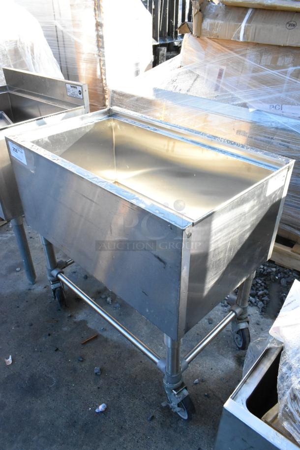 Krowne stainless steel commercial ice bin on casters, excellent condition, with manufacturer's label visible.