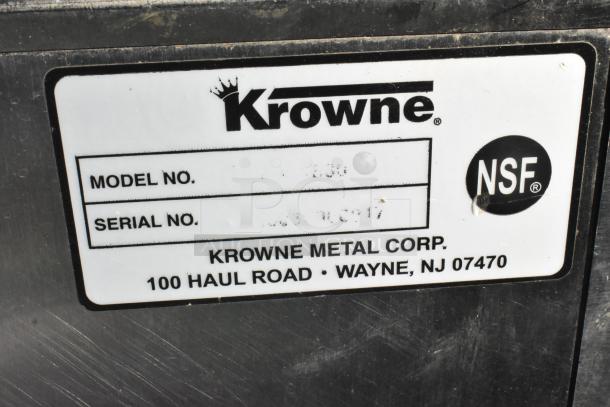 Krowne stainless steel commercial ice bin with visible model and serial numbers. NSF certified, on commercial casters.
