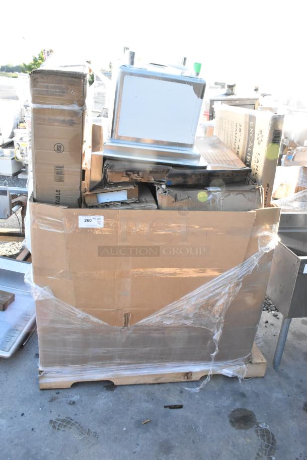 15 new scratch and dent items, including Lancaster table top, Regency hand sink, and stainless work table, in wrapped packaging.