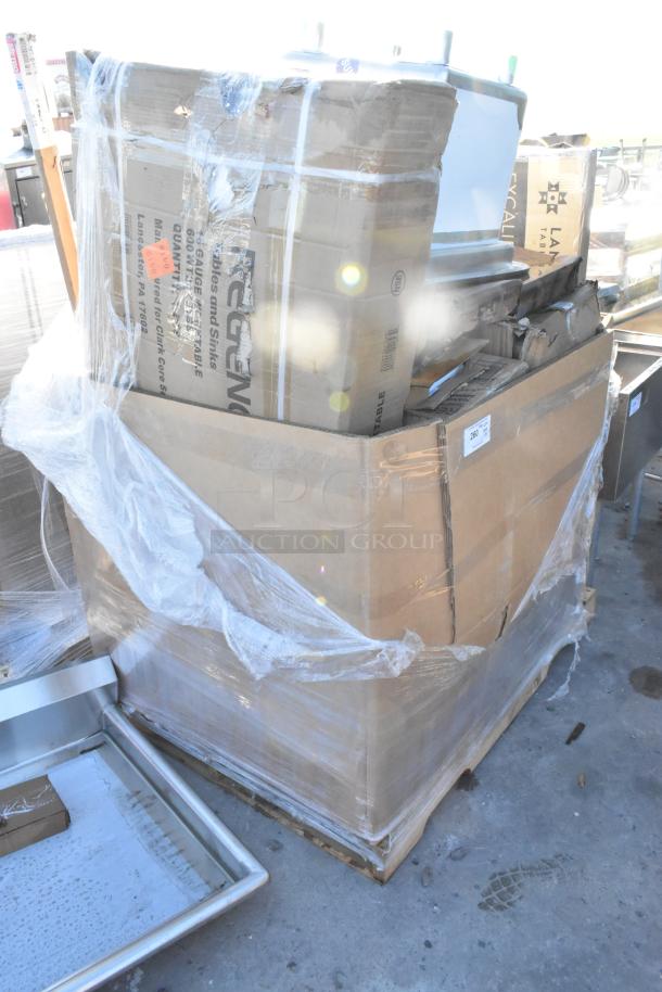 15 brand new scratch and dent items on a pallet, including a Lancaster table top and Regency hand sink and work table, wrapped in plastic.