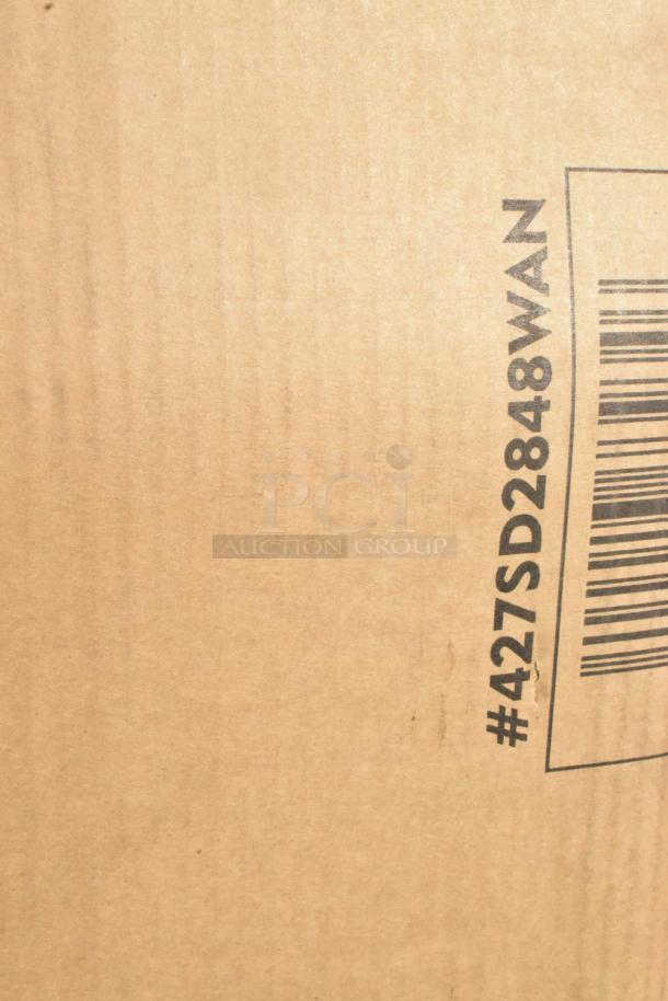 Cardboard box with printed text "#427SD2848WAN" and a barcode, indicating item details for auction.