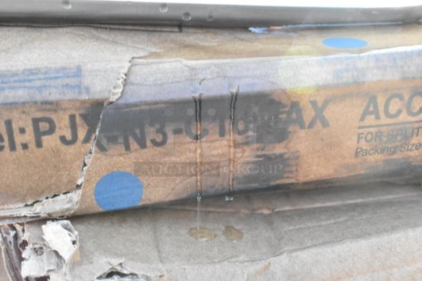 Cardboard box with markings, slight damage visible, containing 15 new scratch and dent items, including Lancaster table top and Regency sinks.