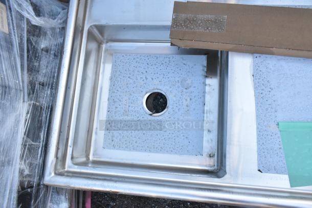 Regency 600UDT60L 60" undercounter dishtable, 16-gauge stainless steel, new condition, minor scratches, sink on left.