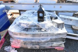 35 black wrought iron metal lanterns stacked and wrapped, one on top. Durable, ideal for decor. 35 times your bid.