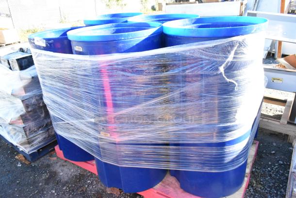 11 blue trash cans wrapped in plastic on a pallet, in good condition. Labels visible, indicating auction item.