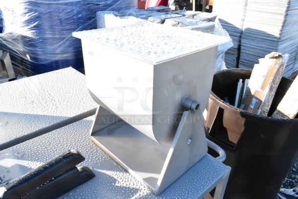 Brand new Backyard Pro BSMM-44T 44 lb. manual tilting meat mixer with removable paddles, slight scratches visible.