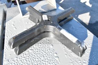 Black metal table base, model 164TB2222, shown with minor scratches and a barcode label, new condition.