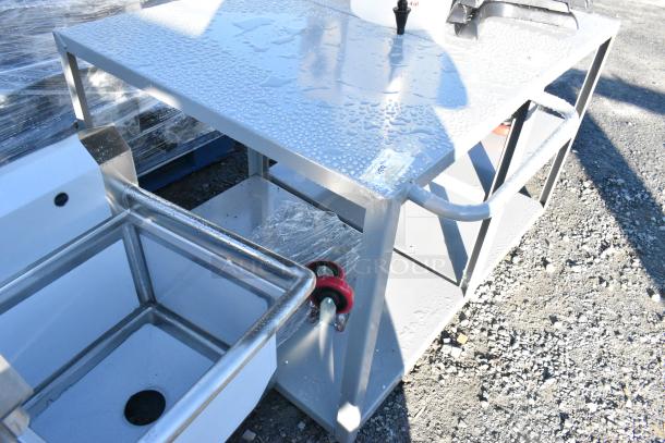 Gray metal 2-tier cart with commercial casters, new with minor scratches, sturdy handles, and visible water droplets.
