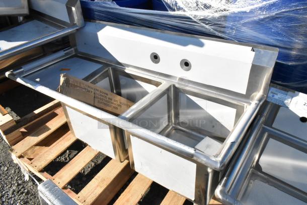 Brand new Regency 600S2171718L stainless steel 2-bay sink with left side drain board, minor cosmetic damage.