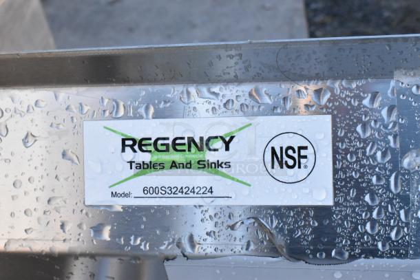 BRAND NEW Regency 600S32424224 3 bay stainless steel sink with dual drain boards, label shows NSF certified. No legs.