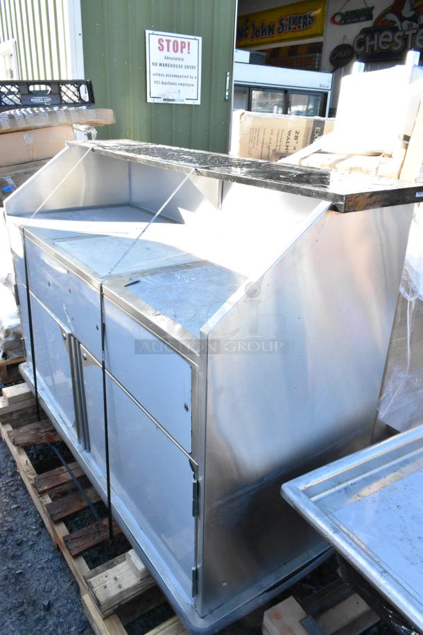 BRAND NEW Regency 600PB63S 63" stainless steel portable bar with two speed rails, ice bin, and cover. Minor scratches visible.