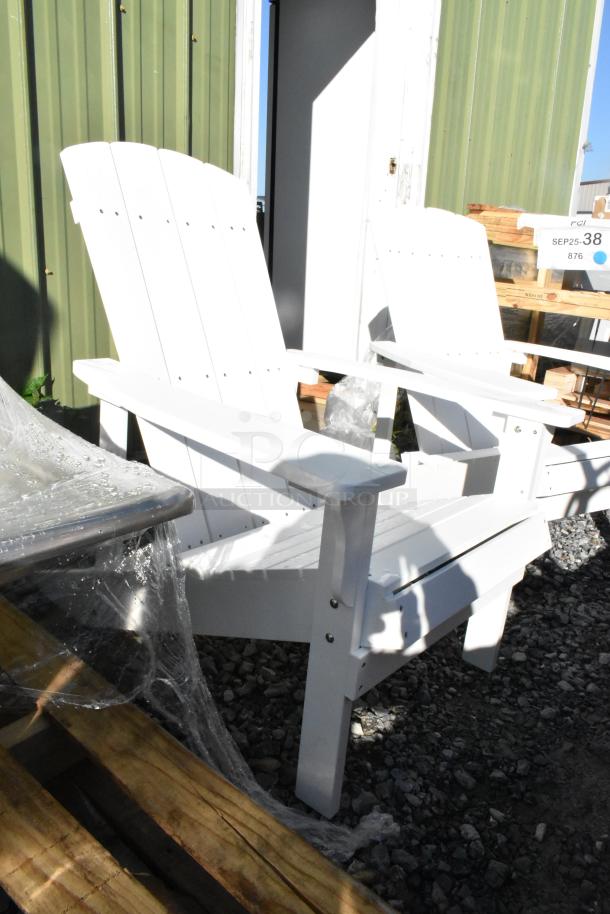 2 brand new white Adirondack chairs, slight scratches and dents; plastic wrap partially visible; auction sign nearby.