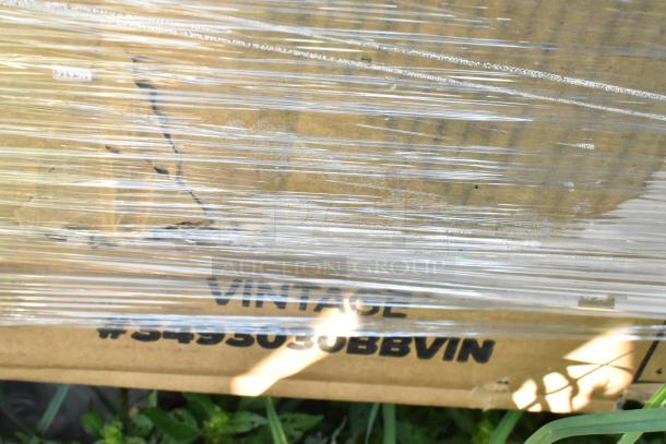 Pallet of 18 brand new scratch and dent items, wrapped in plastic, featuring a visible label with unspecified text.
