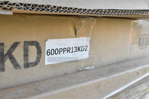 Cardboard box with shipping label "600PPR13KD2," part of a lot including a butcher block tabletop, pizza dough box rack, and equipment stand.