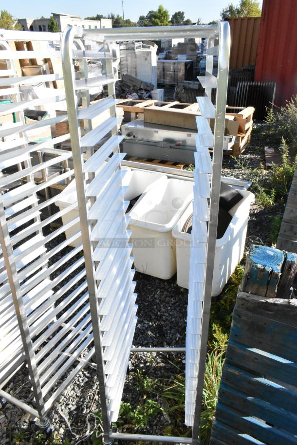 Brand new Regency 600STPR20KD 20 pan aluminum steam table pan rack, visible with slight scratches, outdoor setting.