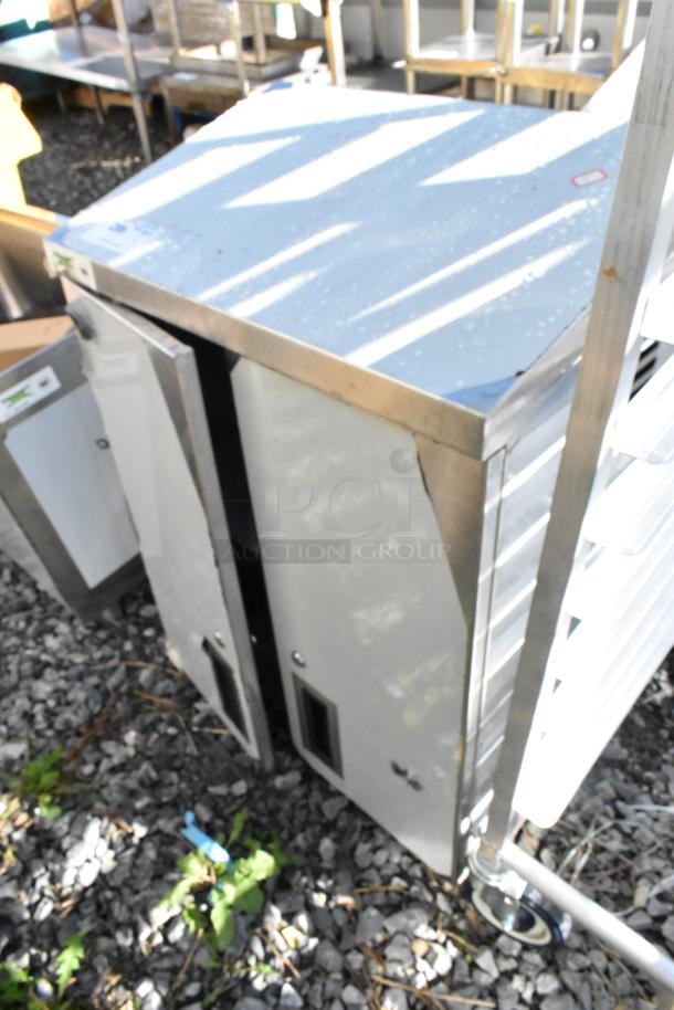 BRAND NEW SCRATCH AND DENT! Regency 600WCH1524 24" stainless steel wall cabinet with hinged doors, minor scratches visible.