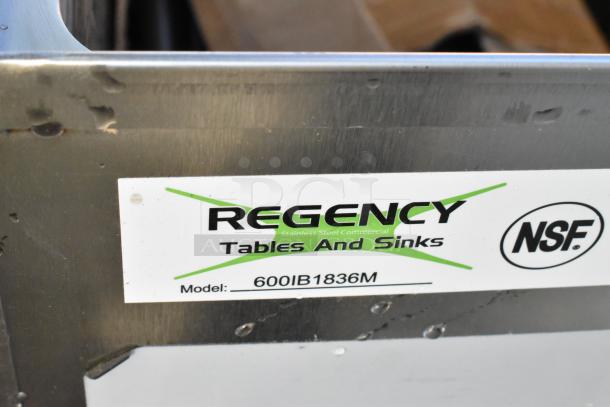 BRAND NEW Regency 600IB1836M 36"x18" stainless steel ice bin with minor scratches. Model label visible. NSF certified.