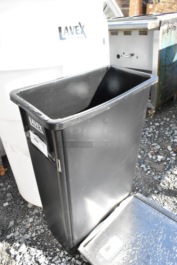 Lavex Black Slim Jim Trash Can, brand new with minor scratches and dents, visible Lavex label on the front.