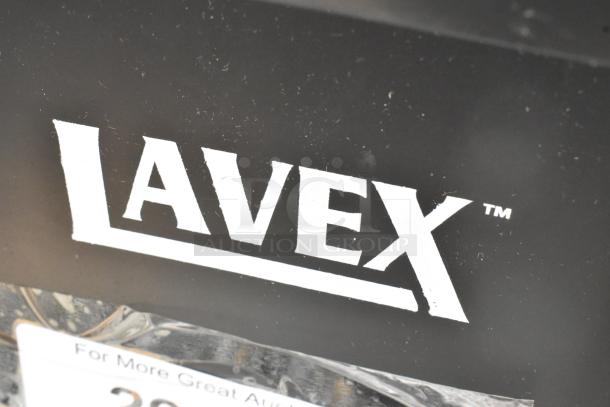 Lavex black poly Slim Jim trash can, scratch and dent, brand new condition. Visible Lavex logo on the front.