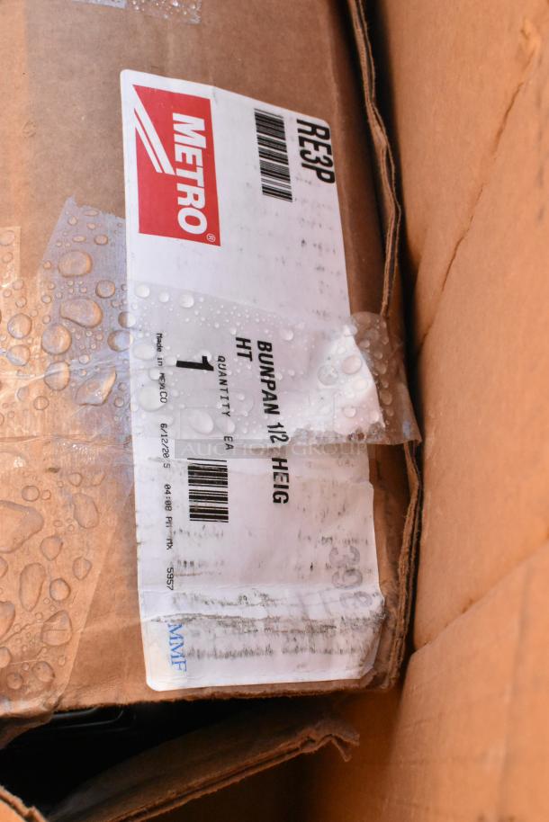 Cardboard box labeled "Metro," containing scratch and dent items; includes tabletops and wire rack. Made in Mexico.