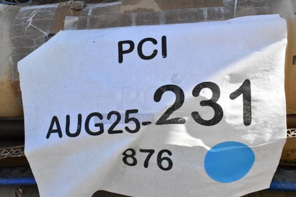 Label on package showing "PCI AUG25-231 876" with blue dot. Contains new scratch and dent items like wire shelves and trash cans.