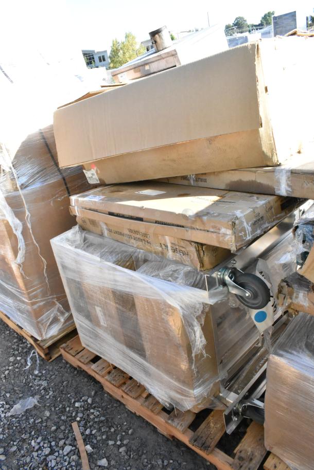 5 brand new scratch and dent items on a pallet, including a can rack and equipment stand, wrapped in clear plastic.