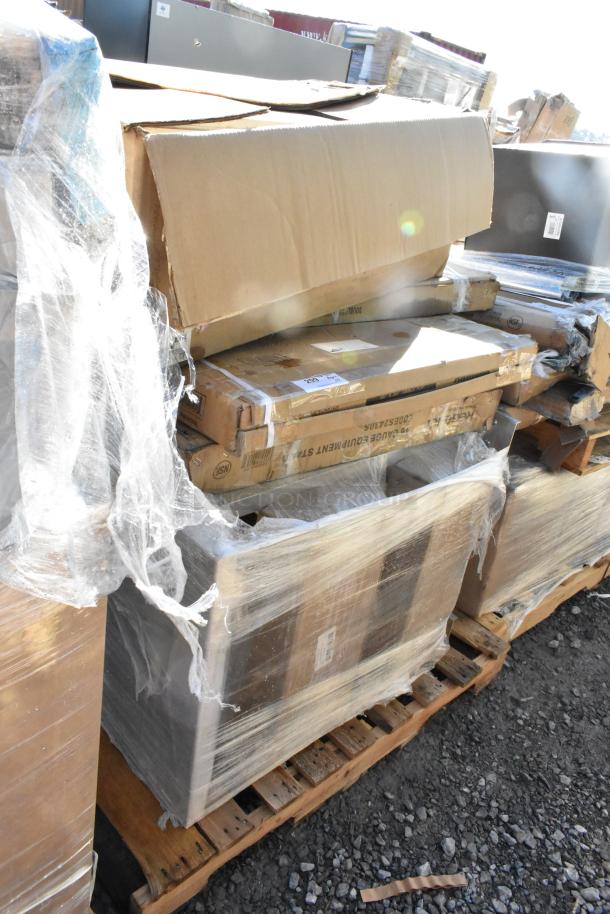 Pallet with 5 new scratch and dent items, including a can rack and equipment stand, in wrapped boxes showing labels.