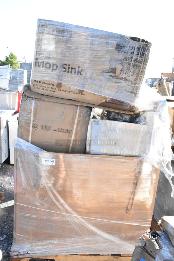 Clear shrink-wrapped pallet with 12 new scratch and dent items, including an ice bin and a mop sink. Visible labels detail contents.