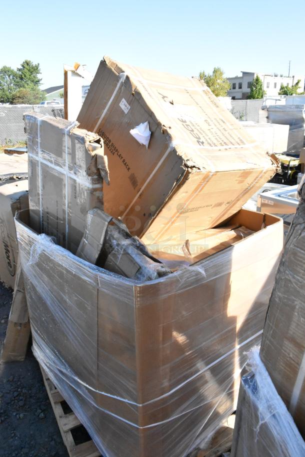 Large pallet of 8 new scratch-and-dent items including shelf, liquor display rack. Boxes show signs of wear.