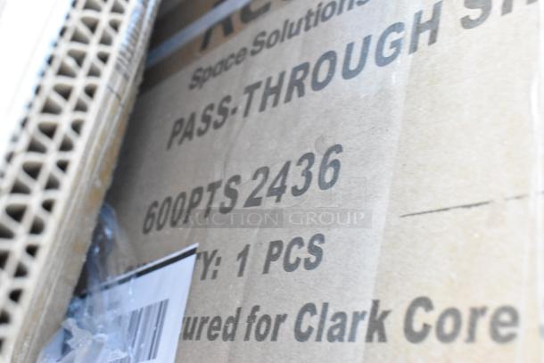 Cardboard box showing text "600PTS 2436" and "Clark Core," indicating a new item, part of a scratch and dent auction.