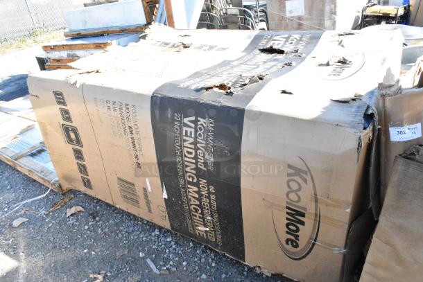BRAND NEW SCRATCH AND DENT! KoolMore KM-VMNT-50-BR non-refrigerated vending machine with 60 slots, damaged packaging.