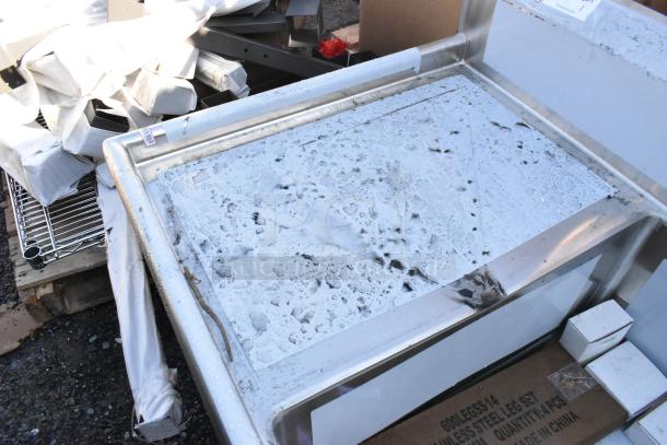 Regency 600S32030224 stainless steel 3 bay sink with dual drain boards, brand new scratch and dent condition, protective film partially intact.