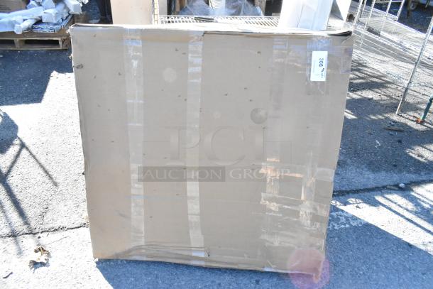 Alt text: Large sealed cardboard box labeled "306" indicating Canarm AX30-2 exhaust fan inside, scratch and dent condition.