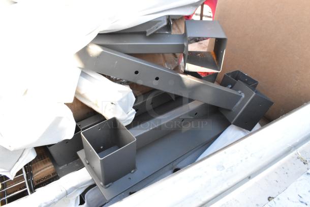 Lot of new scratch and dent items including chrome finish wire shelves and metal pieces, visible wear on surfaces.