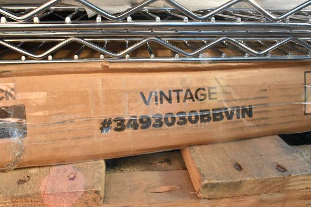 Lot of scratch and dent chrome finish wire shelves and metal pieces. Box marked "VINTAGE #3493030BBVIN".