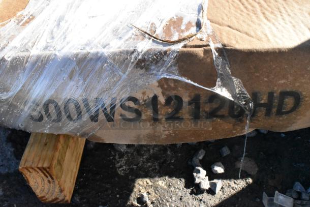 Stacked items with visible "600WS12120HD" marking, wrapped in plastic. New, scratch and dent condition, Regency shelf.